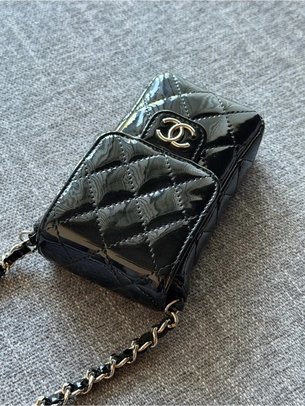 CHANEL Black Patent Leather Quilted Phone Case with Silver Hardware